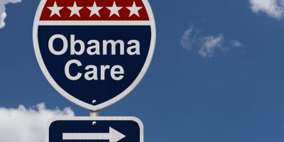 Obamacare,Sign,,A,Red,,White,And,Blue,Highway,Sign,With